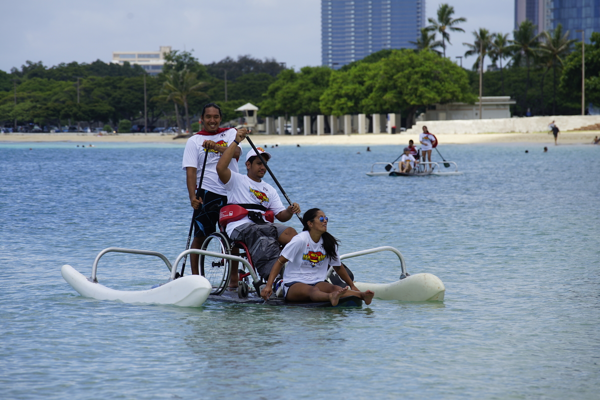 Volunteer for Adaptive Freedom Foundation and Just Like Me "Paddle Day at the Bay" Banner