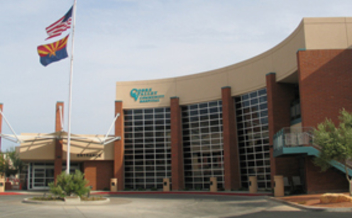 Volunteer at COVID vaccination POD in Globe Banner