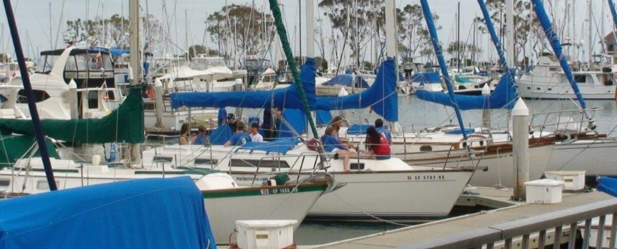 Watch the races from the deck of a large sailboat Banner